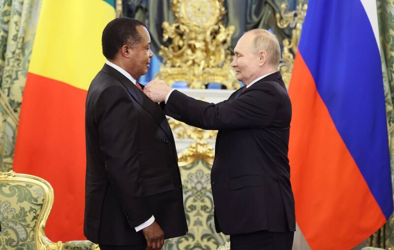 Russian President Vladimir Putin hands over the Order of Honor to Congolese President Denis Sassou Nguesso