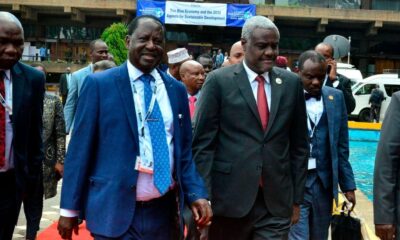 Kenya’s former prime minister Raila Odinga (L) walks with Africa Union Commission Chairperson Moussa Faki (R) in Nairobi, Kenya on November 8, 2018