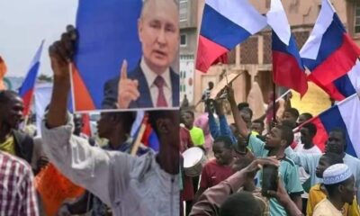 Protesters carrying russian flag